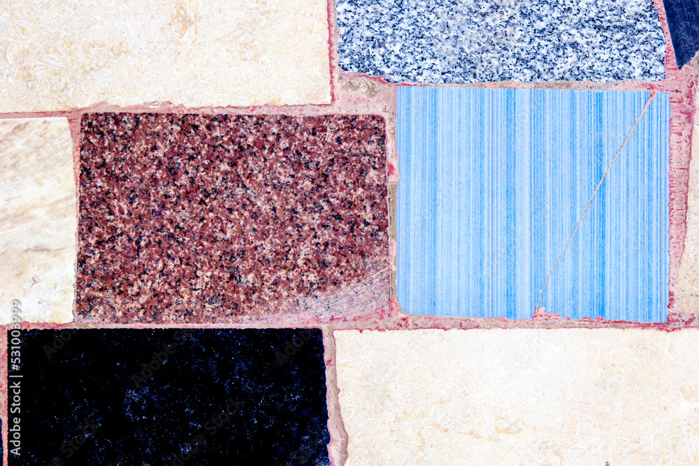 Fototapeta premium Wall, path, with tiled mosaics and granite pieces.