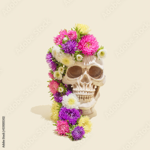 Realistic human skull with colorful flowers. Aesthetic Mexican Day of the Dead (Dia De Los Muertos) or Halloween concept.