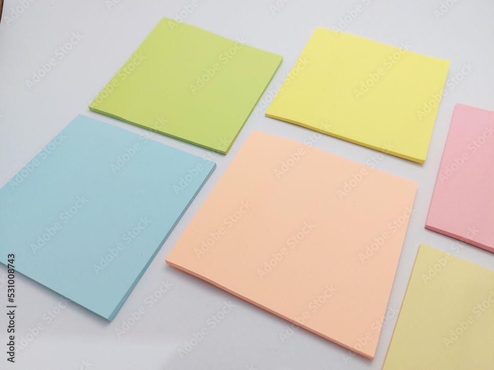 Fototapeta premium Small colorful notepad ( stiky notes ) on a white background