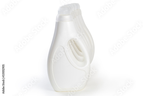 Plastic bottles of liquid laundry detergent on a white background