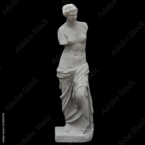plaster statue of an antique woman on a black background