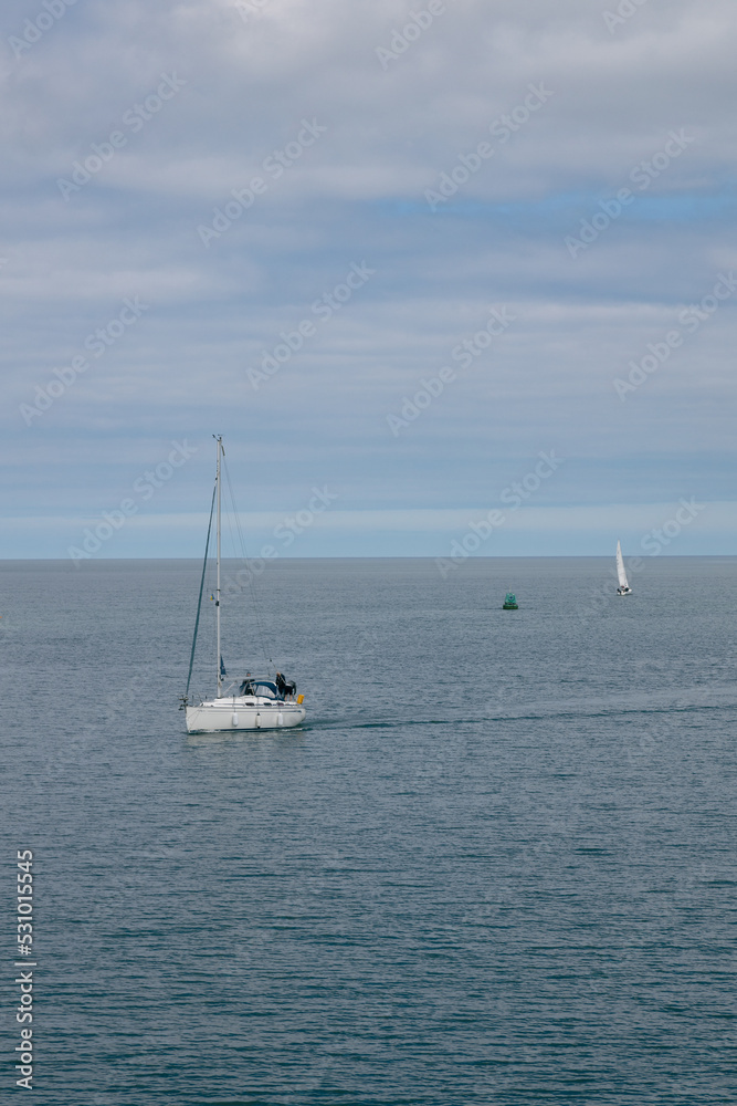 Sailboats and yachts at sea in the amazing light of the sunset on the sea bay in Howth, Ireland Sailboats and yachts at sea in the amazing light of the sunset on the sea bay in Howth, Ireland