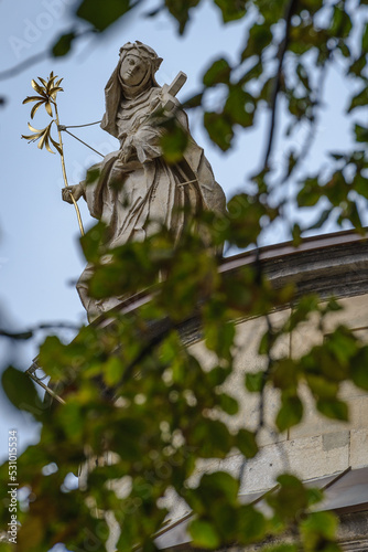 Lviv, UKraine - September 2022: Figure of the Dominican nun located on the eaves of of the Holy Eucharist church (former Dominican church). 