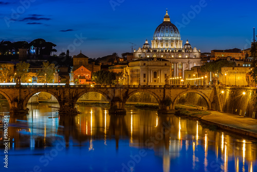 Sunset view of Basilica Saint Peter, bridge Sant Angelo and river Tiber in Rome. Italy. Architecture and landmark of Rome. Postcard of Rome #531015768
