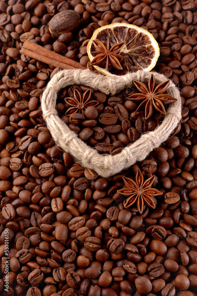 Coffee beans with a cinnamon stick and star anise Coffee beans with a cinnamon stick and star anise