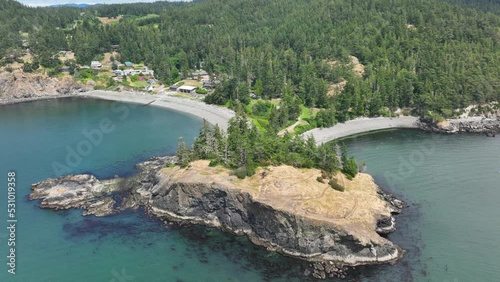 Aerial view tilting down over the Rosario Beach cliff side in Washington State. photo