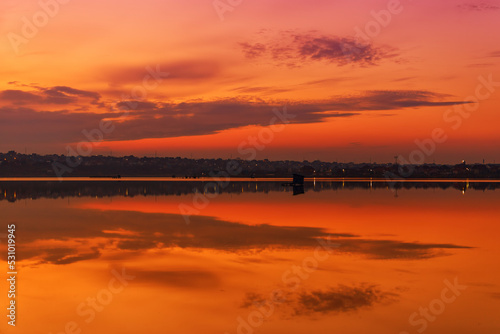 Sunset on the lake with reflection