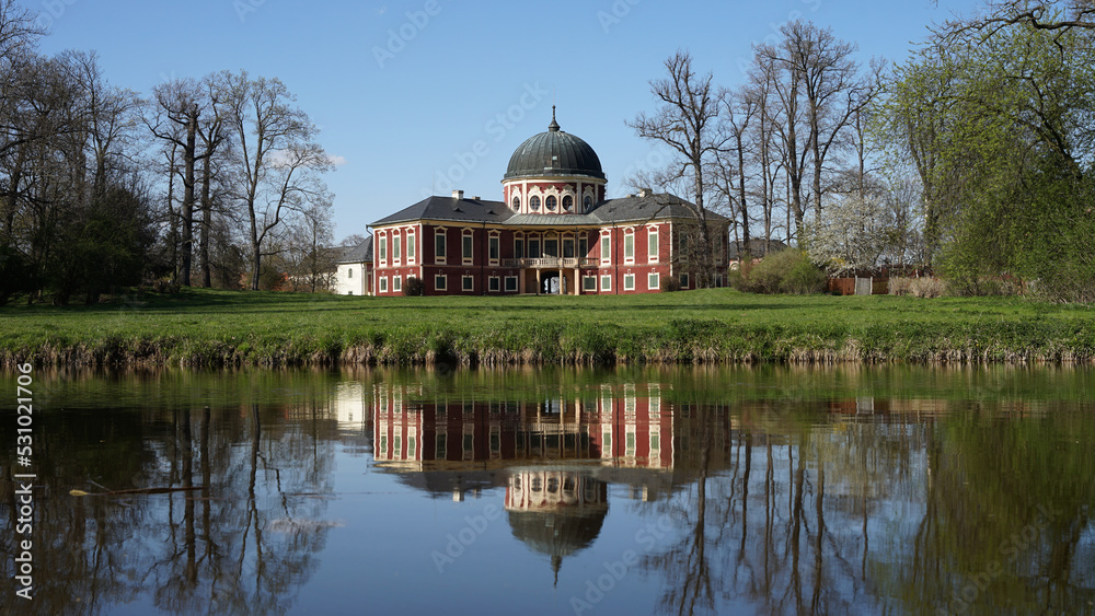 Veltrusy Mansion (Zamek Veltrusy), baroque chateau mirroring in pond, popular tourist landmark, Czechia