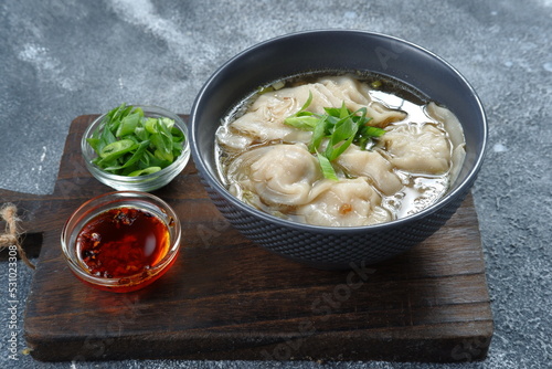 delicious of wonton soup with chili oil and green onion,chinese food,asian food style 
