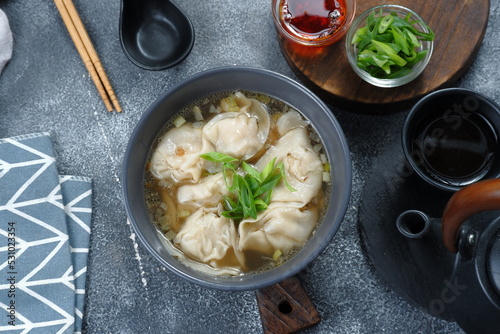 delicious of wonton soup with chili oil and green onion,chinese food,asian food style  photo