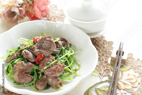 Chinese cuisine, chicken gizzard and pea sprout stir fried photo