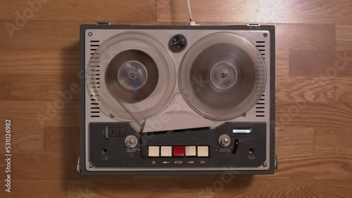 Top view of a old tape recorder playing and rewinding