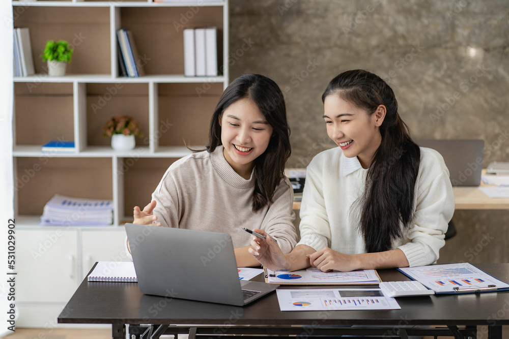 2 cute Asian women working in the finance office concept accountant 2 cute Asian women working in the finance office concept accountant