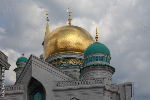 The picturesque domes of the Moscow Cathedral Mosque against the backdrop of a stormy sky