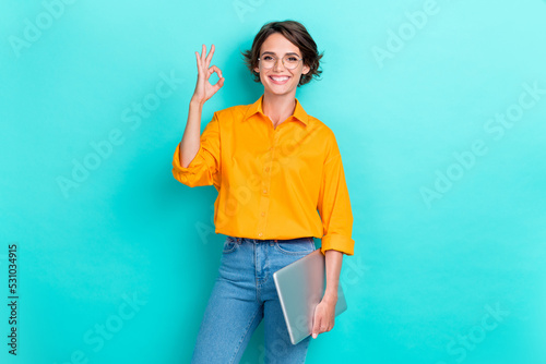 Tableau sur toile Portrait photo of young adorable gorgeous nice woman wear shirt hold computer to