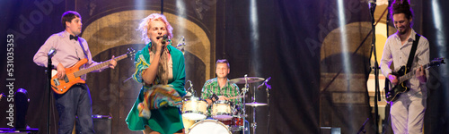Photography Rock band playing music on the concert stage at night