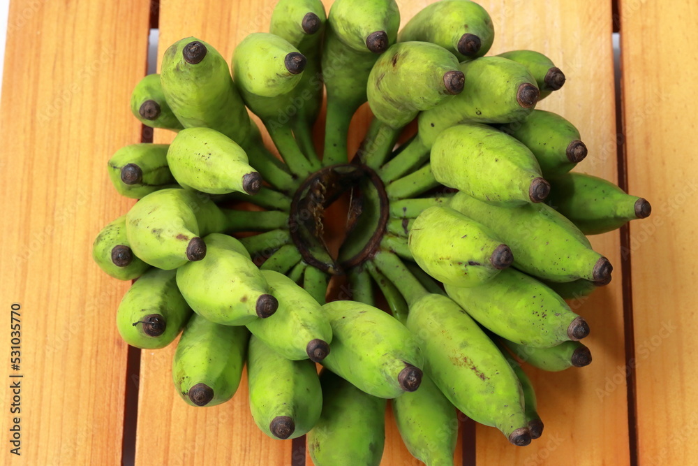 Bananas on wooden background. Fantastic bunch of banana collection. Ripe bunch of banana