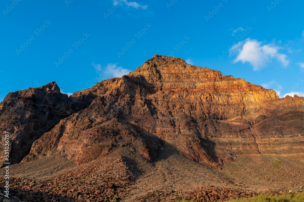 Scenic view on the massive sharp cliffs and mountain Cueva de Cabras in the La Mercia mountain range in Valle Gran Rey, La Gomera, Canary Islands, Spain, Europe. Summit in the Garajonay national park