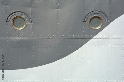 Wall - port - starboard with portholes of the ship.