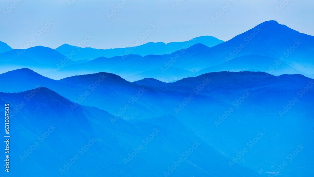Beautiful shot of blue mountains ideal for wallpapers - obrazy, fototapety, plakaty 