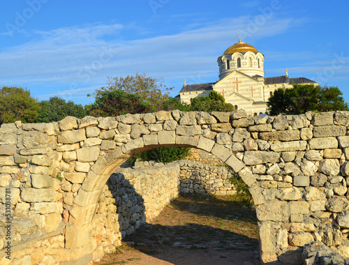 Ancient stone wall and arch in Chersonesos with a view of St. Vladimir s Cathedral