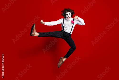 Full length body size view of his he handsome funky cheerful cheery creepy energetic gentleman jumping dancing pirouette having fun calavera isolated bright vivid shine vibrant red color background