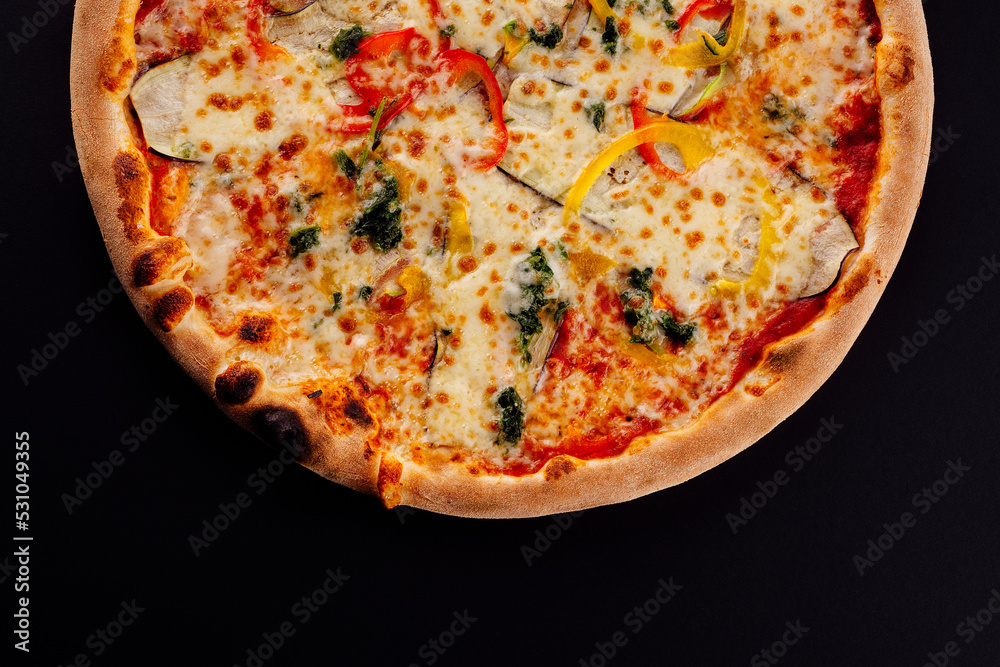 italian vegetarian pizza on black background italian vegetarian pizza on black background