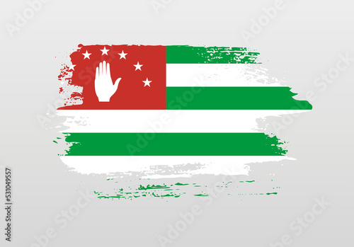 Modern style brush painted splash flag of Abkhazia with solid background