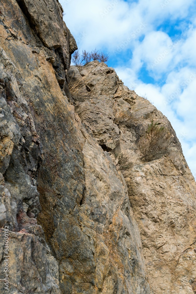 Rock of red tuff against the sky in the mountains of Armenia.