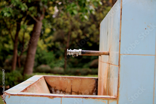 Iron Water Tap in Garden, Almatti, Karnataka. photo