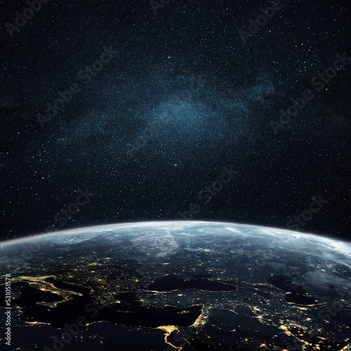Beautiful amazing blue planet earth with night lights of megacities and cities in open space with stars. Space view of planet earth.