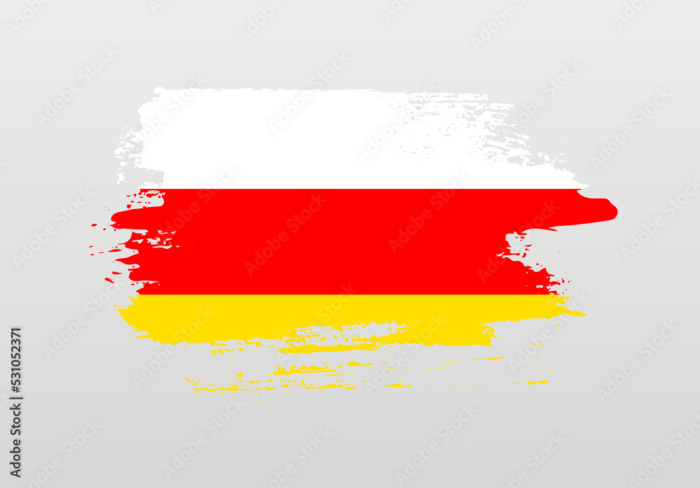 Fototapeta premium Modern style brush painted splash flag of South Ossetia with solid background