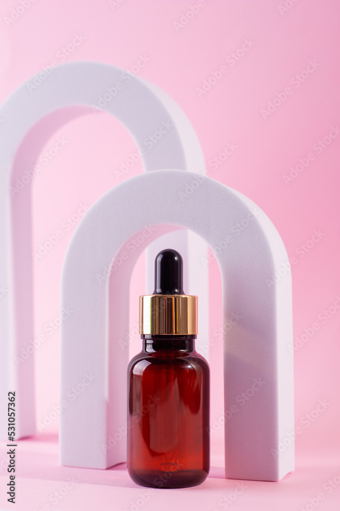 Cosmetic bottle with serum in arch. Skin care cosmetic. Hyaluronic acid oil, serum with collagen and peptides. Cosmetic bottle with serum in arch. Skin care cosmetic. Hyaluronic acid oil, serum with collagen and peptides.