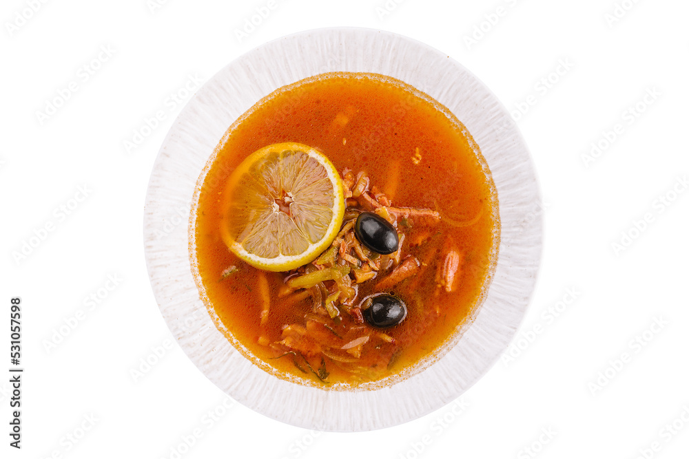 Solyanka mix soup with sausages, olives and lemon Solyanka mix soup with sausages, olives and lemon