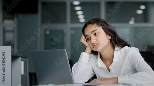 Canvas Print Young excited woman losing online gambling game upset female office worker works