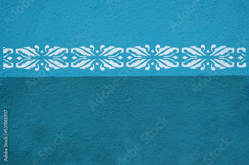 Geometric ornament on blue wall