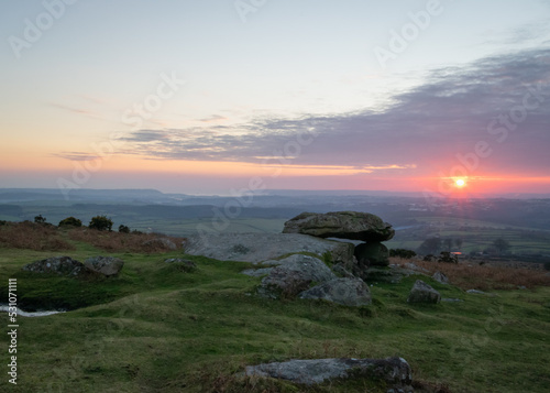Sunset over Dartmoor with Tor in the foreground