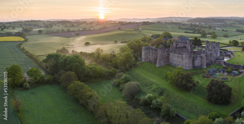 Aerial view of Raglan Castle at dawn, Raglan, Monmouthshire, Wales photo