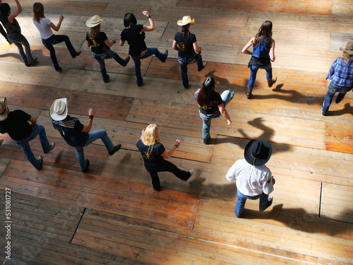 Group of traditional western folk music dancers view from above blur dynamism effect