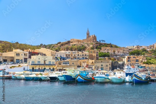 Mgarr Harbour, with the Church of The Madonna of Lourdes behind, Ghajnsielem, Gozo, Malta, Mediterranean photo