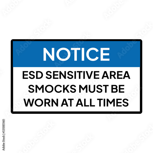 Warning sign or label for industrial.  Caution or notice for ESD sensitive area smocks must be worn at all times.