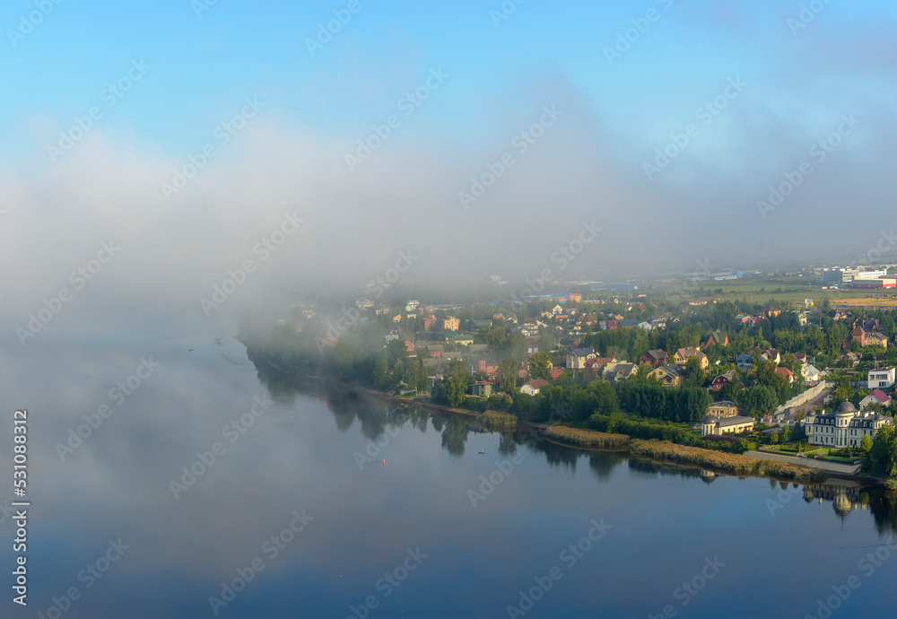 Morning fog over the city and the Neva river. Morning fog over the city and the Neva river.