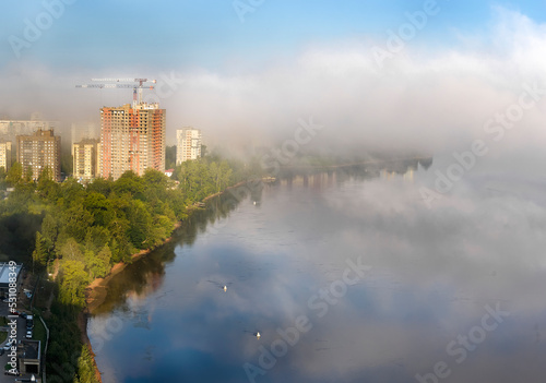 Morning fog over the city and the Neva river.
