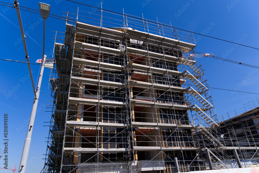 Construction site of apartment buildings at City of Zürich on a sunny late summer afternoon. Photo taken September 2nd, 2022, Zurich Schwamendingen, Switzerland. Construction site of apartment buildings at City of Zürich on a sunny late summer afternoon. Photo taken September 2nd, 2022, Zurich Schwamendingen, Switzerland.