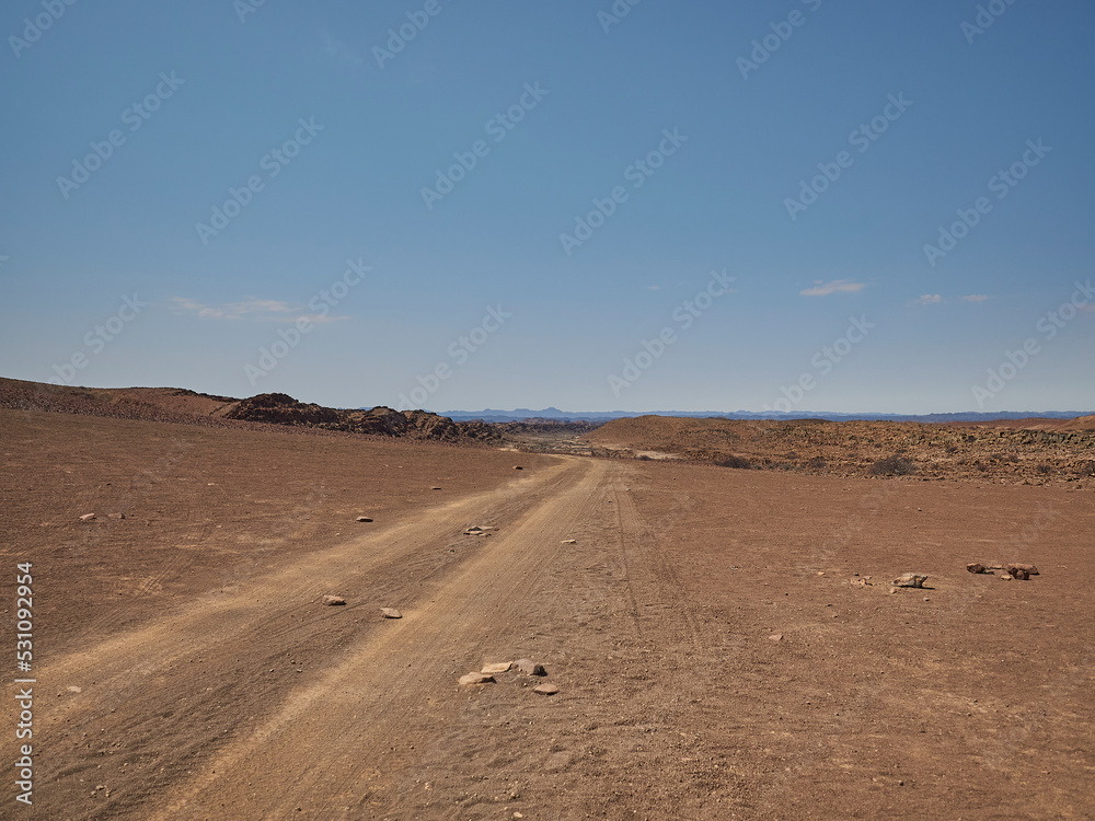 Gravel road through the arid region of the Damarland Namibia