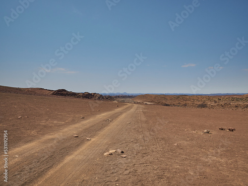 Gravel road through the arid region of the Damarland Namibia