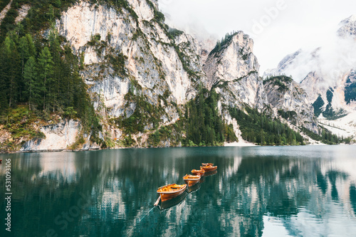 Natural landscapes of the mountain lake Braies in the Dolomites, Italy. Reflection of a mountain in the water.