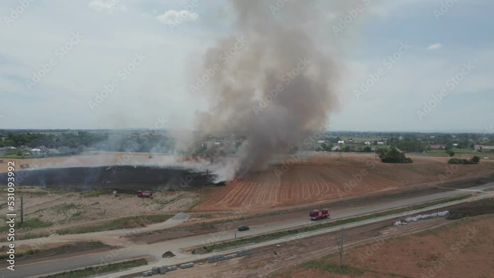 A burning agricultural field. A huge grain fire extinguished by the fire department. A burning agricultural field. A huge grain fire extinguished by the fire department.