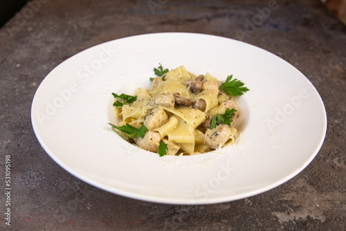 Fettuccine chicken with mushrooms in cream sauce