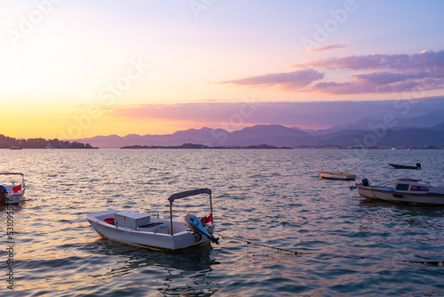 Fototapeta Naklejka Na Ścianę i Meble -  Boat in sunset floating on the sea in Turkey